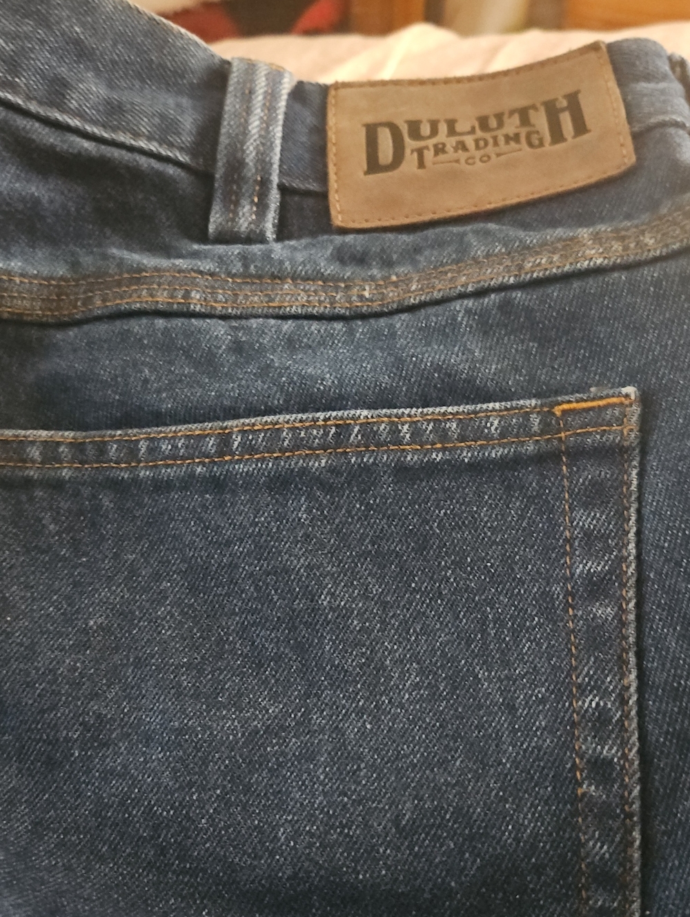Duluth Trading Co Men's Dark Blue Straight Jeans with Contrast Stitching.